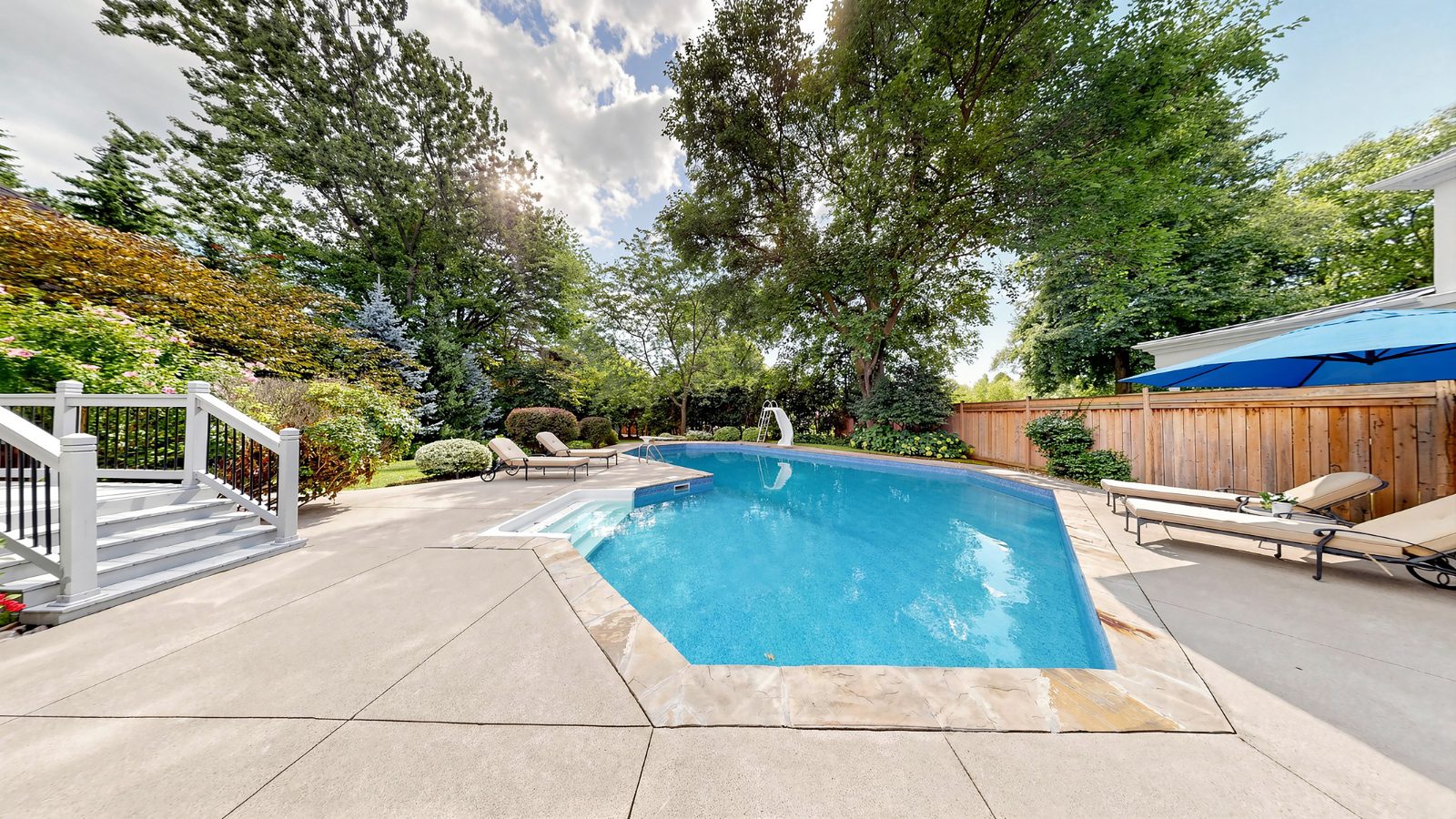 Inground pool with slide and diving board