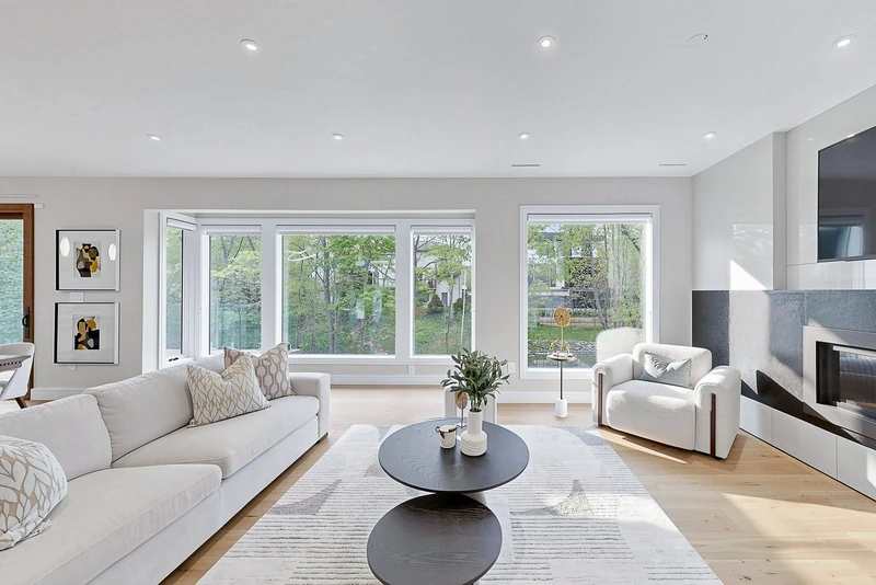 The living room, three windows of trees