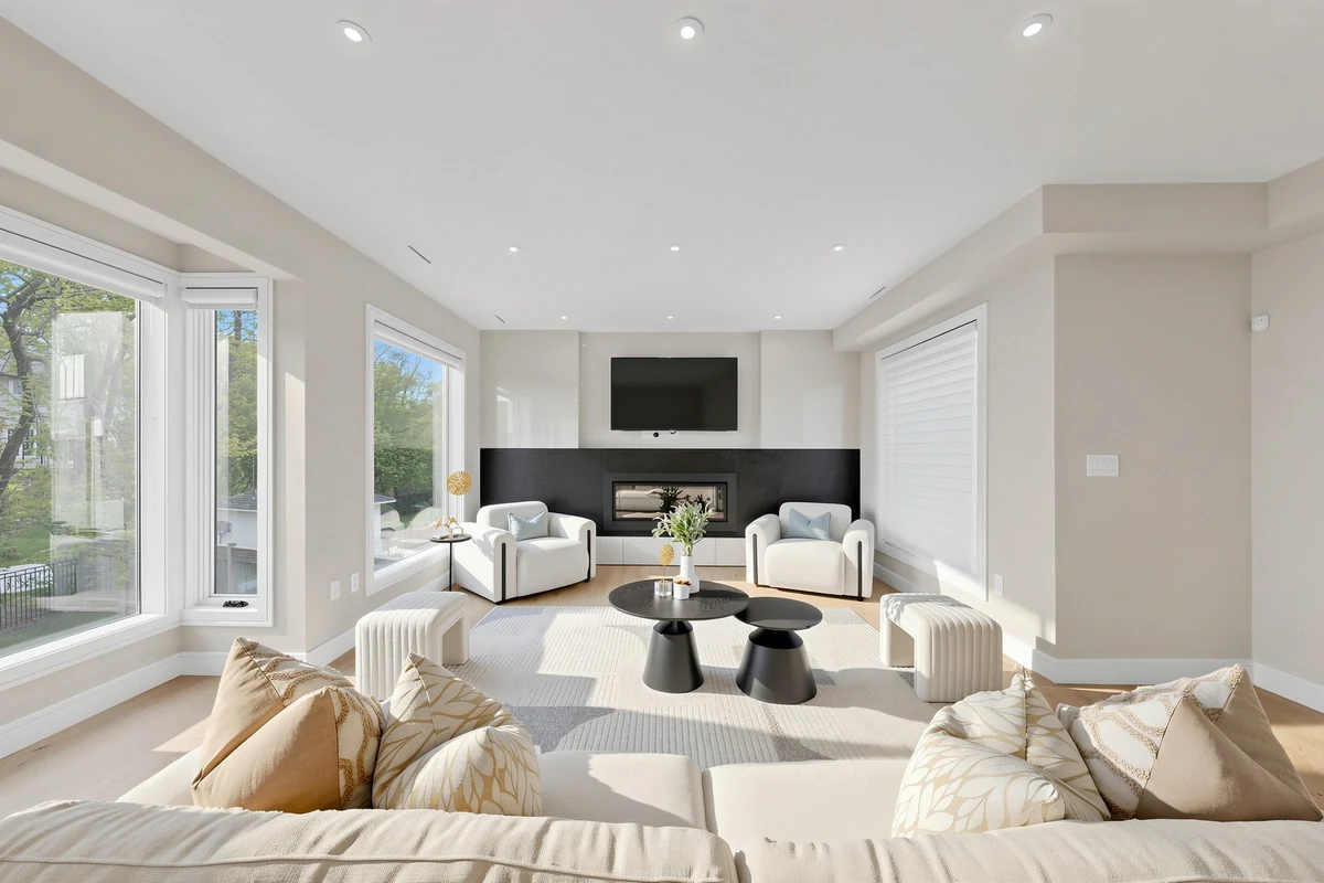 Living room with a central fireplace and balanced seating
